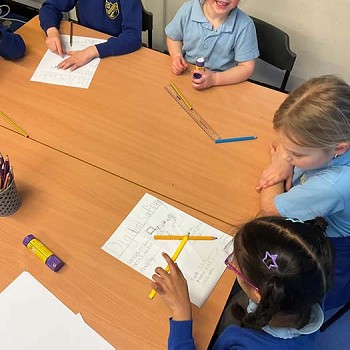 Children creating posters on digital safety