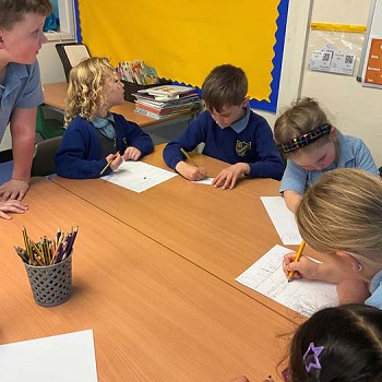 Children enjoying making posters on digital safety